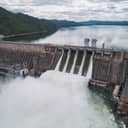 aerial view of a hydroelectric dam showing water being released
